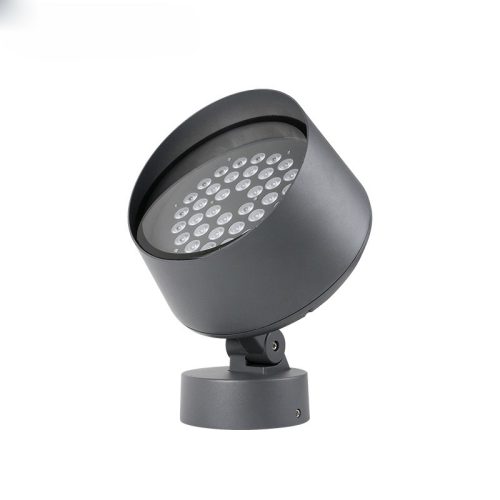 An outdoor spotlight fixture casting a focused beam of light onto a specific area, enhancing visibility and adding ambiance to the outdoor space.